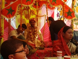 The groom on his stage, one of the few shots of him smiling and not looking confused!